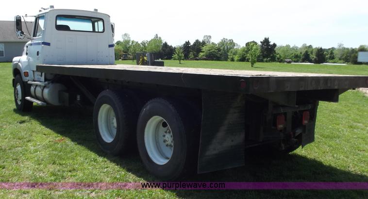 image for item C2024 1996 Ford LTA9000 AeroMax flatbed dump truck