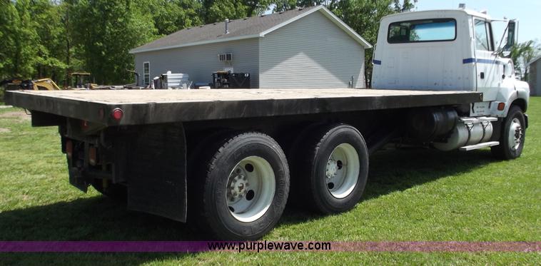 image for item C2024 1996 Ford LTA9000 AeroMax flatbed dump truck