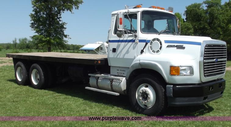 image for item C2024 1996 Ford LTA9000 AeroMax flatbed dump truck