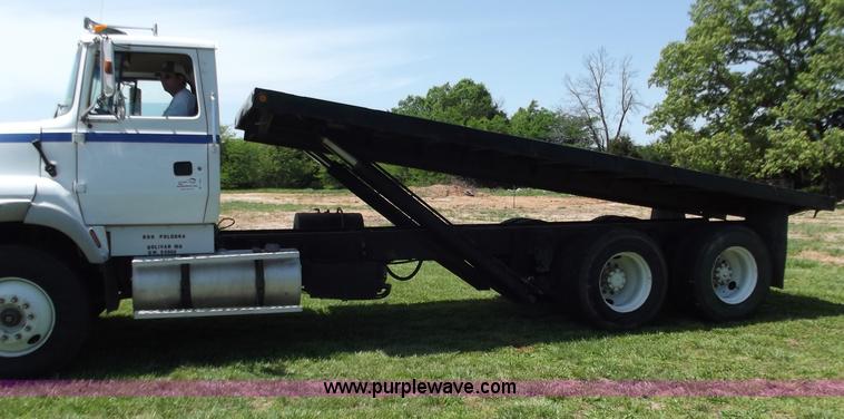 image for item C2024 1996 Ford LTA9000 AeroMax flatbed dump truck