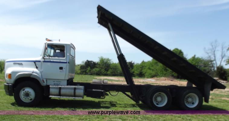 image for item C2024 1996 Ford LTA9000 AeroMax flatbed dump truck
