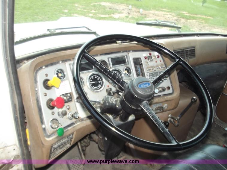 image for item C2024 1996 Ford LTA9000 AeroMax flatbed dump truck