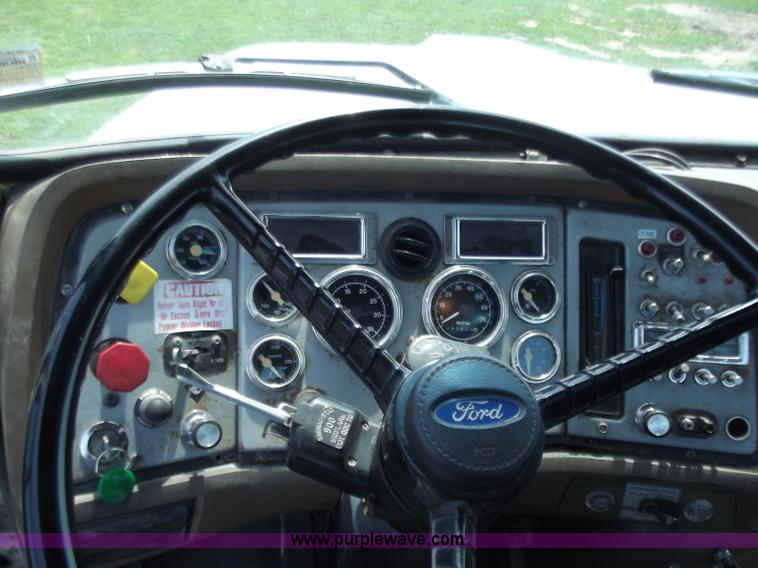 image for item C2024 1996 Ford LTA9000 AeroMax flatbed dump truck