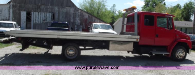 image for item C2014 1998 Freightliner FL60 business class roll back extended cab truck