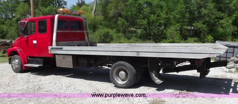 image for item C2014 1998 Freightliner FL60 business class roll back extended cab truck