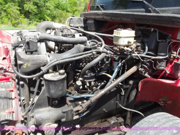 image for item C2014 1998 Freightliner FL60 business class roll back extended cab truck