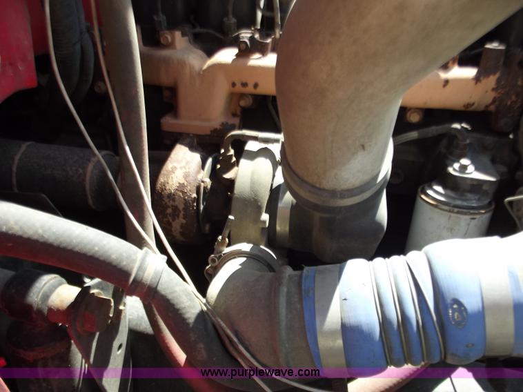 image for item C2014 1998 Freightliner FL60 business class roll back extended cab truck