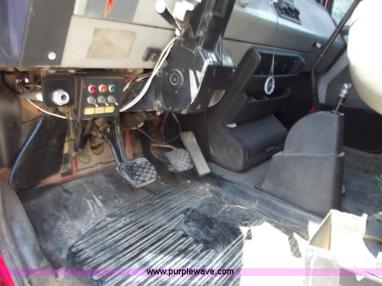 image for item C2014 1998 Freightliner FL60 business class roll back extended cab truck