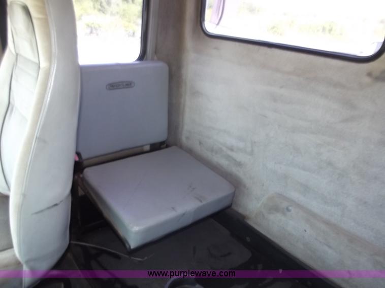 image for item C2014 1998 Freightliner FL60 business class roll back extended cab truck