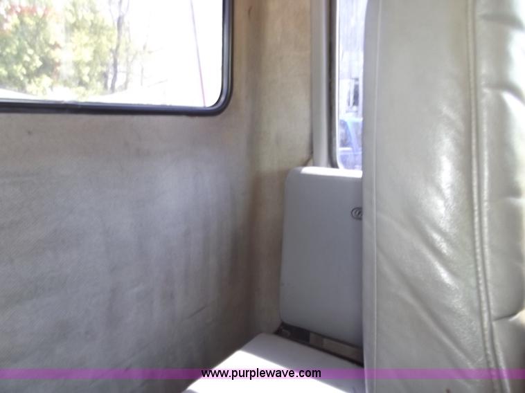 image for item C2014 1998 Freightliner FL60 business class roll back extended cab truck