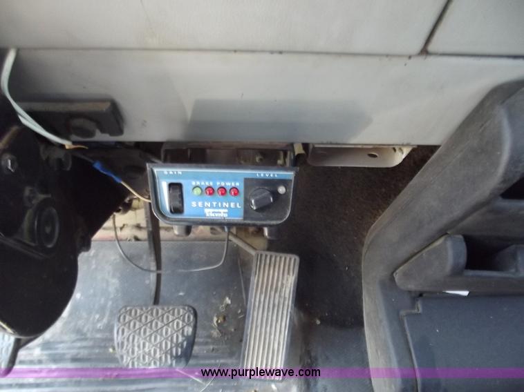 image for item C2014 1998 Freightliner FL60 business class roll back extended cab truck