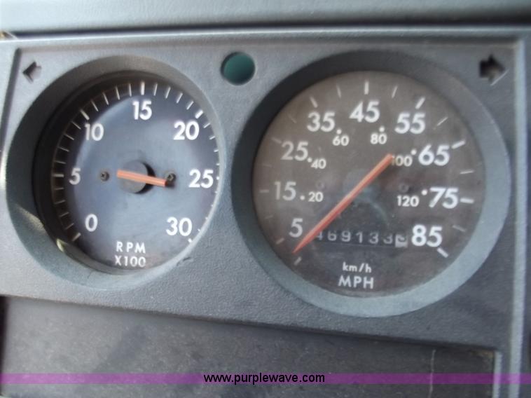 image for item C2014 1998 Freightliner FL60 business class roll back extended cab truck