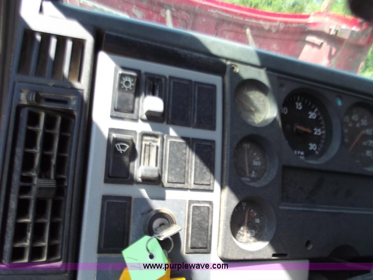 image for item C2014 1998 Freightliner FL60 business class roll back extended cab truck