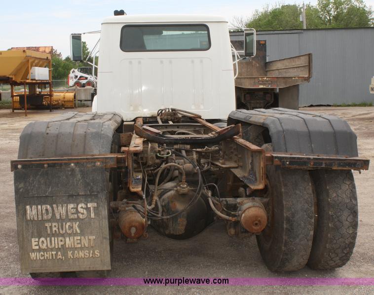 image for item B6597 2001 International 4900 semi truck cab and chassis