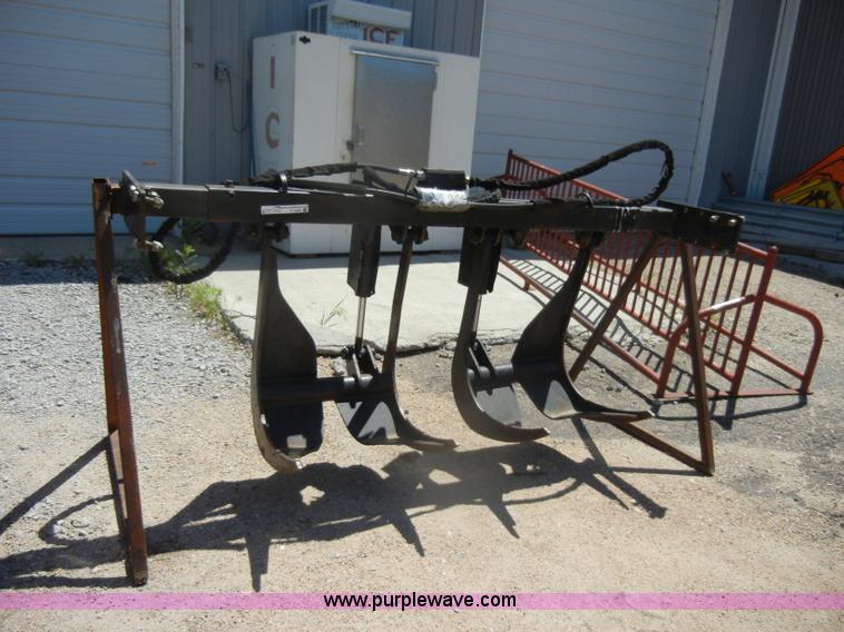 image for item K9204 Tree limb/brush grapple attachment for skid steer