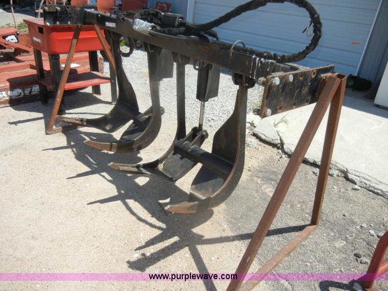 image for item K9204 Tree limb/brush grapple attachment for skid steer