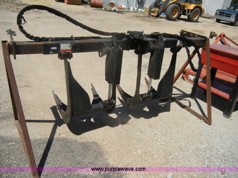 image for item K9204 Tree limb/brush grapple attachment for skid steer