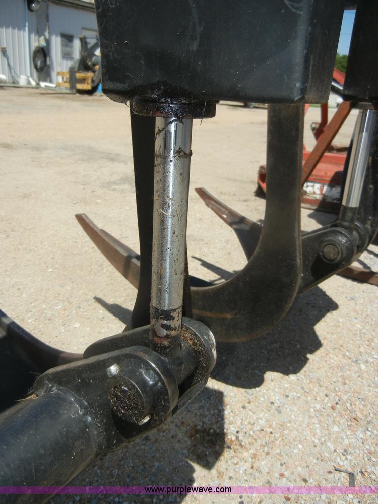 image for item K9204 Tree limb/brush grapple attachment for skid steer