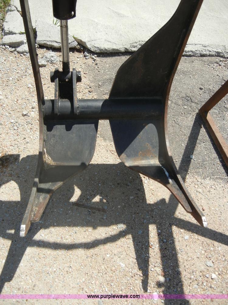 image for item K9204 Tree limb/brush grapple attachment for skid steer