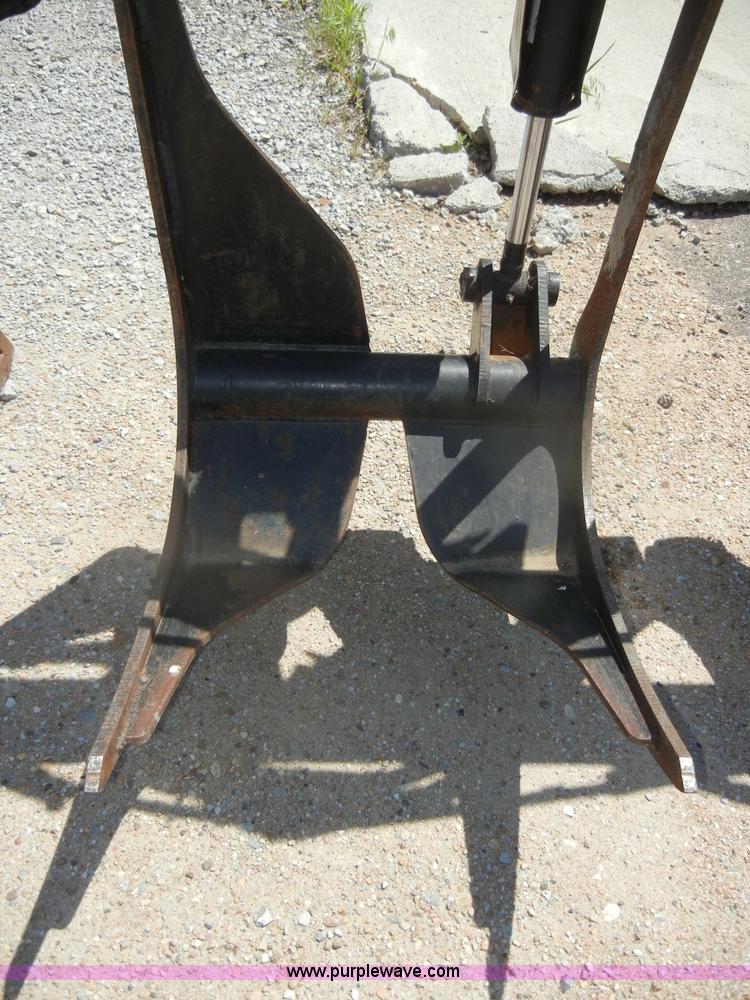 image for item K9204 Tree limb/brush grapple attachment for skid steer