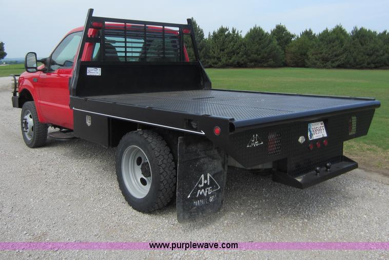 image for item C5496 2001 Ford F450 XL Super Duty flatbed pickup truck