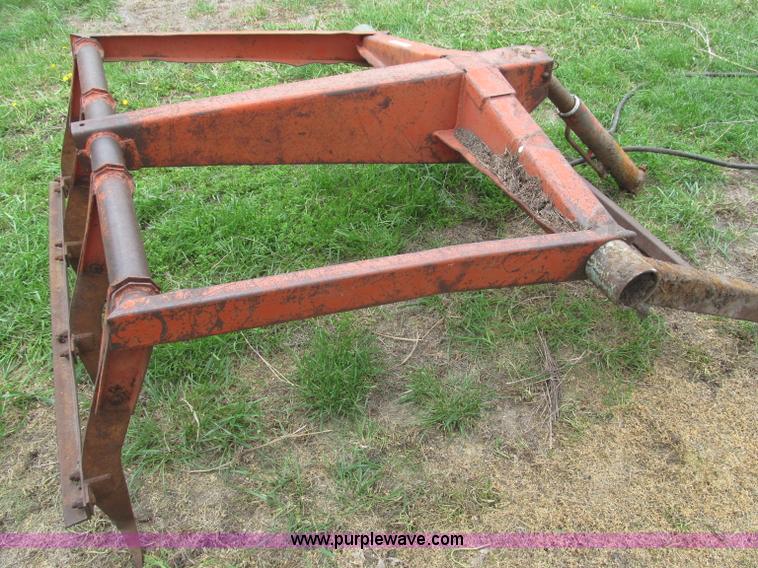 image for item G9486 1973 Dual 320 bucket mount grapple forks