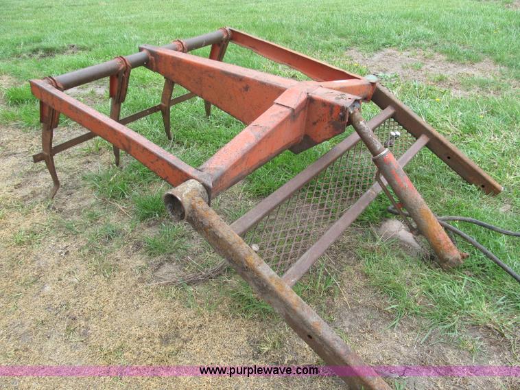 image for item G9486 1973 Dual 320 bucket mount grapple forks