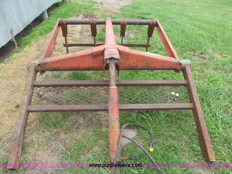 image for item G9486 1973 Dual 320 bucket mount grapple forks
