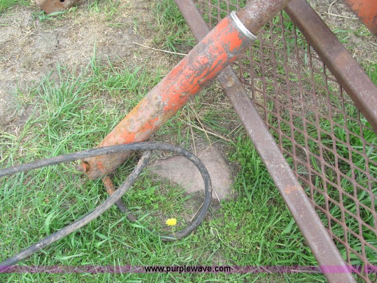 image for item G9486 1973 Dual 320 bucket mount grapple forks