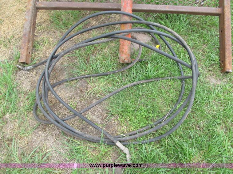 image for item G9486 1973 Dual 320 bucket mount grapple forks