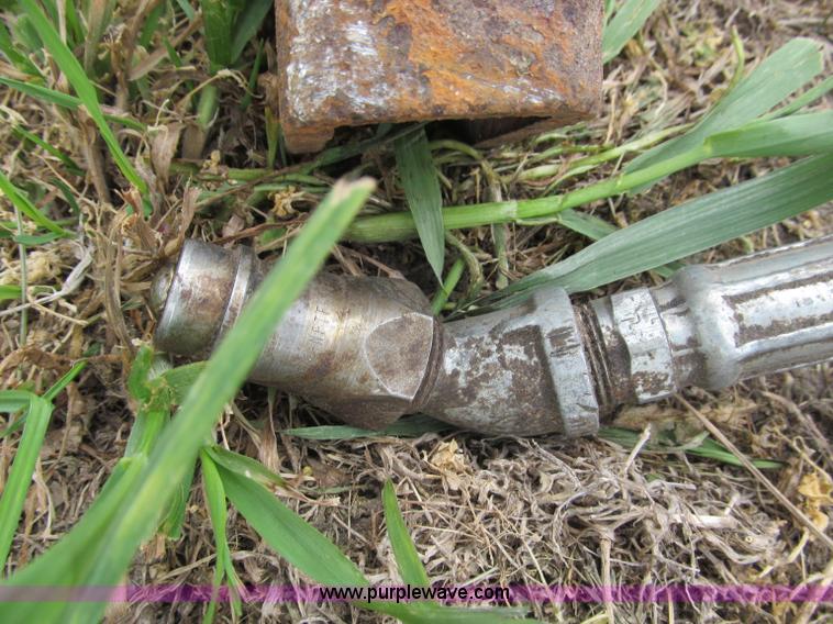 image for item G9486 1973 Dual 320 bucket mount grapple forks