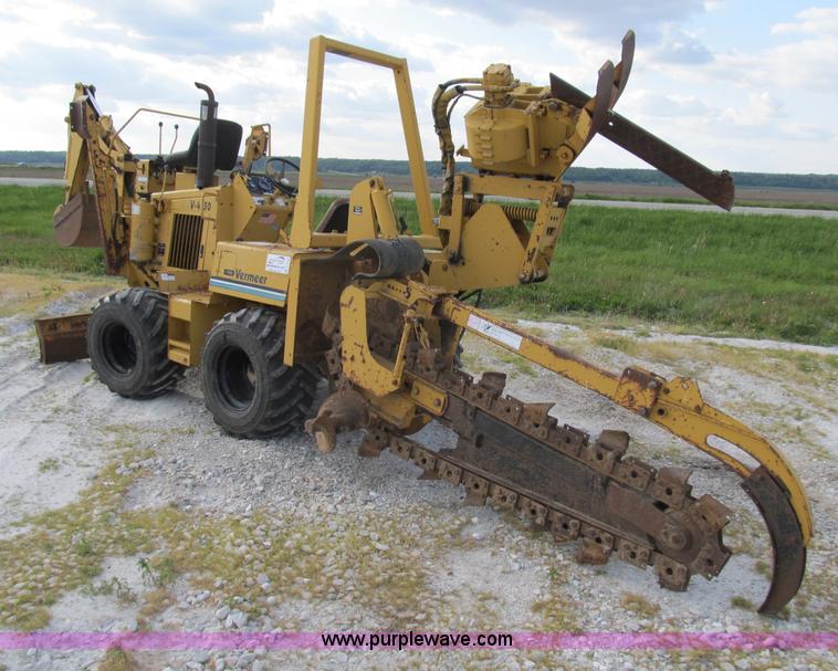 image for item B2702 1999 Vermeer V4750 trencher/backhoe combo with cable plow