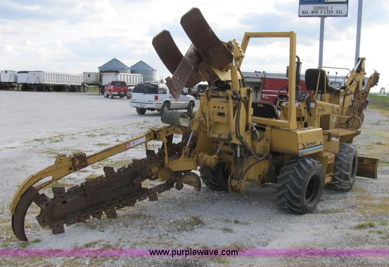 image for item B2702 1999 Vermeer V4750 trencher/backhoe combo with cable plow