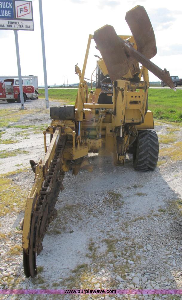 image for item B2702 1999 Vermeer V4750 trencher/backhoe combo with cable plow