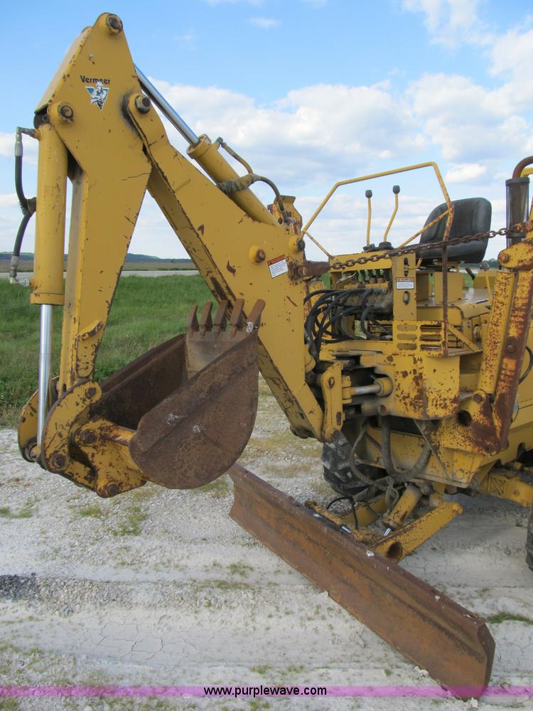 image for item B2702 1999 Vermeer V4750 trencher/backhoe combo with cable plow