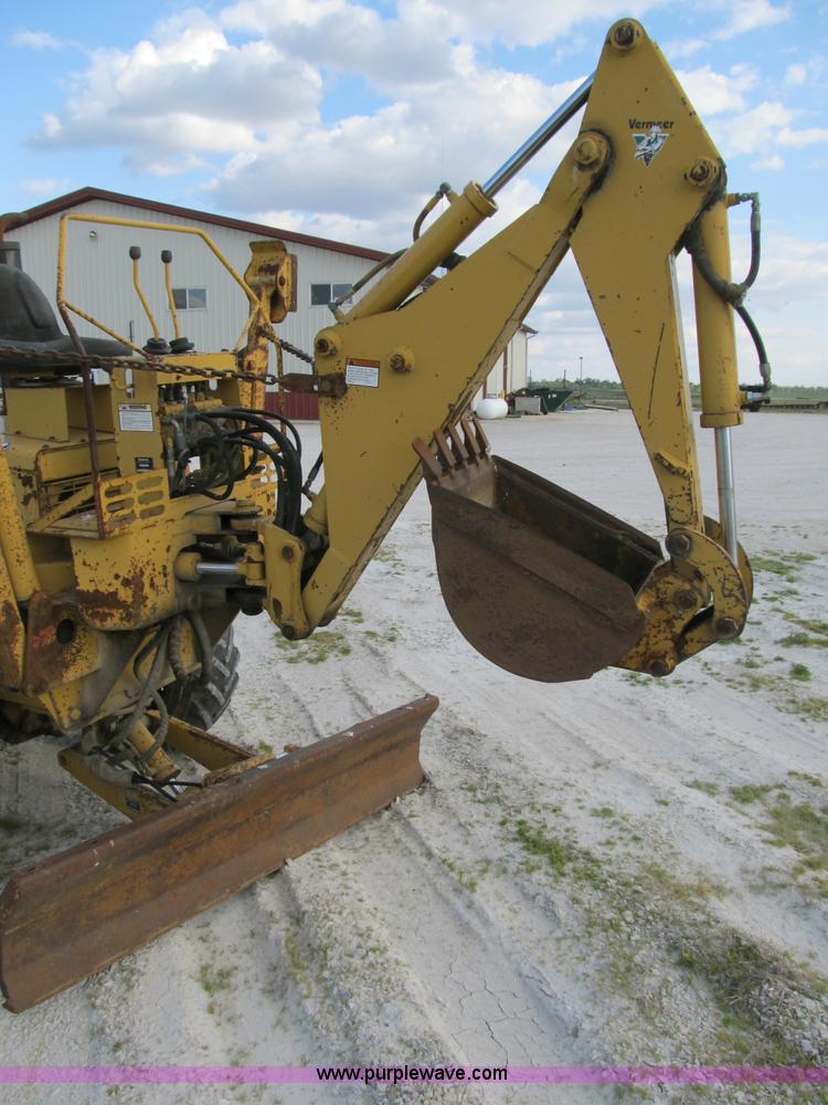 image for item B2702 1999 Vermeer V4750 trencher/backhoe combo with cable plow