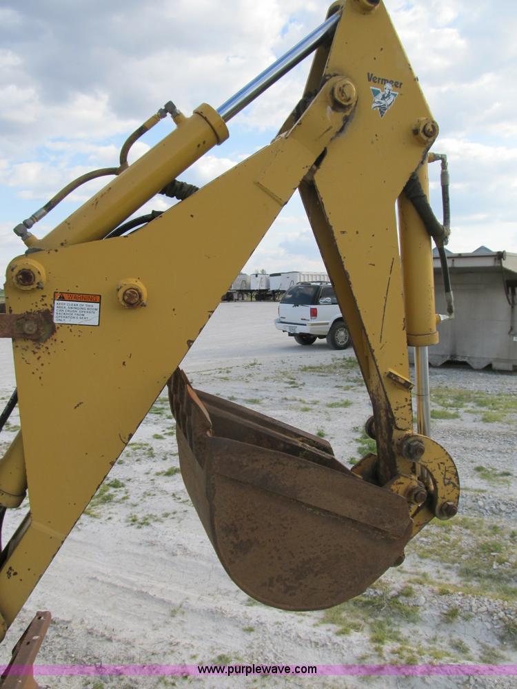 image for item B2702 1999 Vermeer V4750 trencher/backhoe combo with cable plow