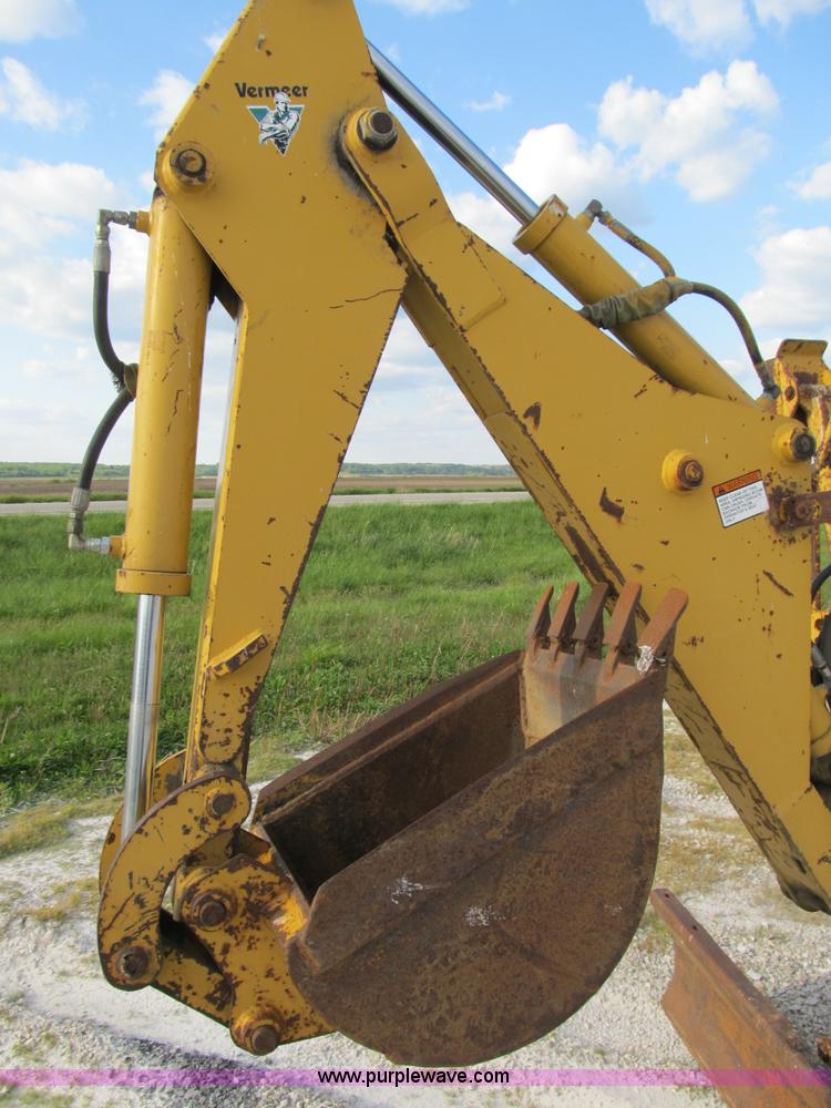 image for item B2702 1999 Vermeer V4750 trencher/backhoe combo with cable plow