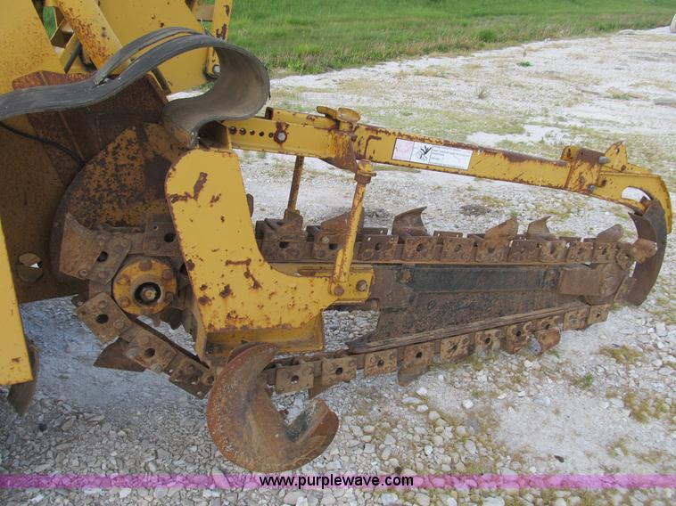 image for item B2702 1999 Vermeer V4750 trencher/backhoe combo with cable plow