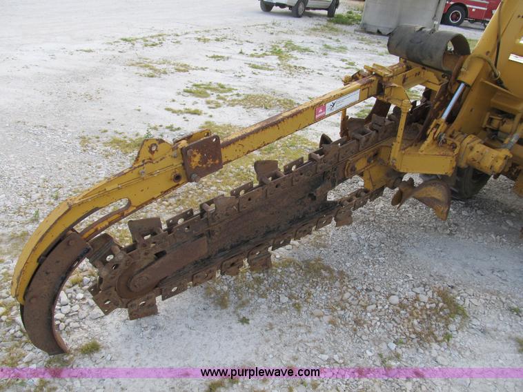 image for item B2702 1999 Vermeer V4750 trencher/backhoe combo with cable plow