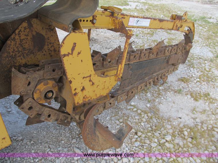image for item B2702 1999 Vermeer V4750 trencher/backhoe combo with cable plow