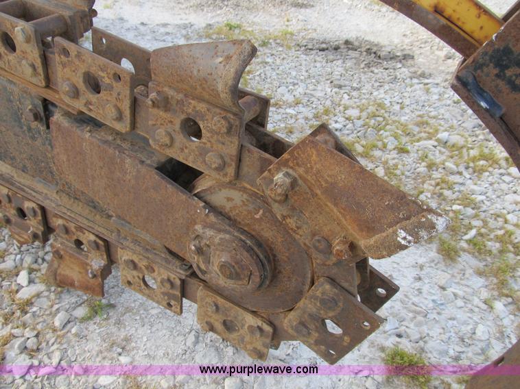 image for item B2702 1999 Vermeer V4750 trencher/backhoe combo with cable plow