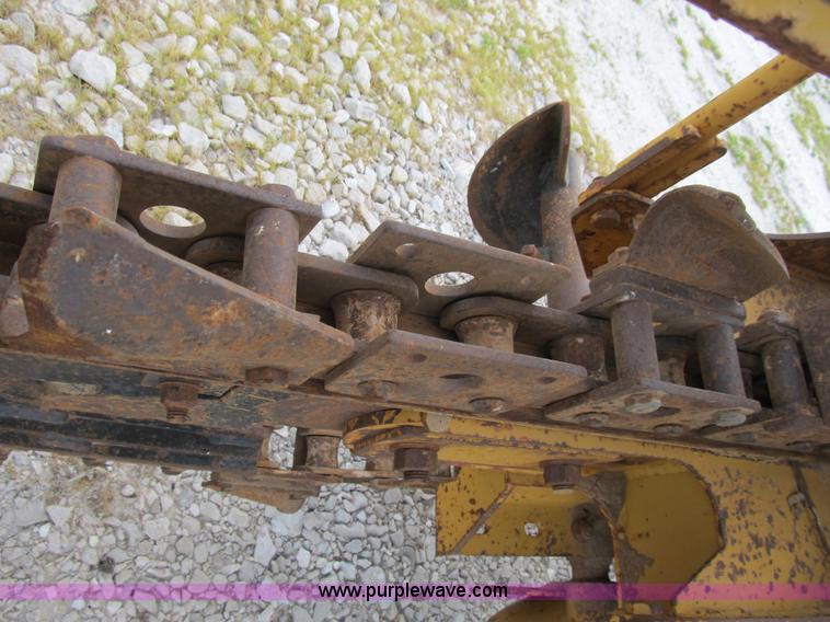 image for item B2702 1999 Vermeer V4750 trencher/backhoe combo with cable plow