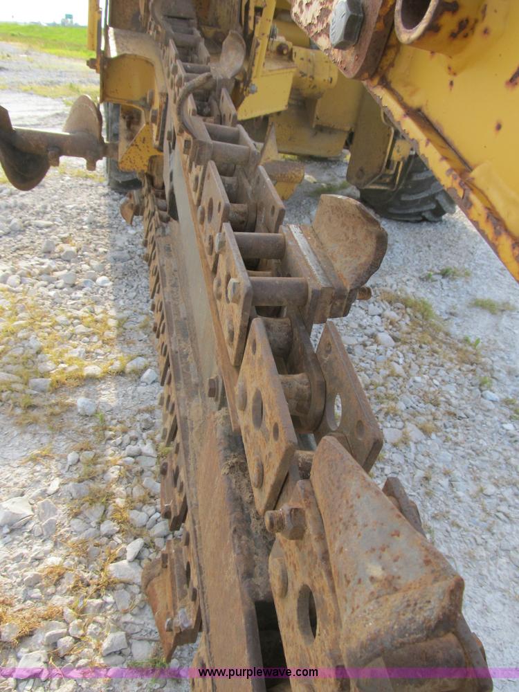 image for item B2702 1999 Vermeer V4750 trencher/backhoe combo with cable plow