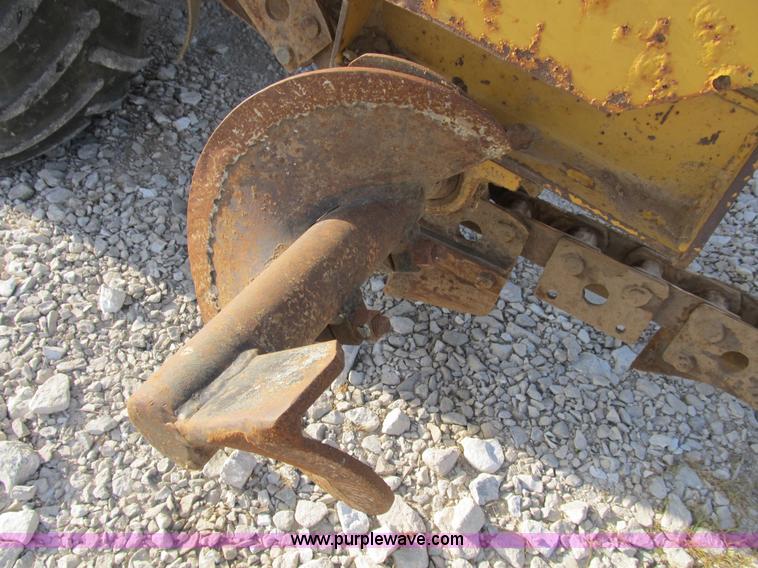 image for item B2702 1999 Vermeer V4750 trencher/backhoe combo with cable plow