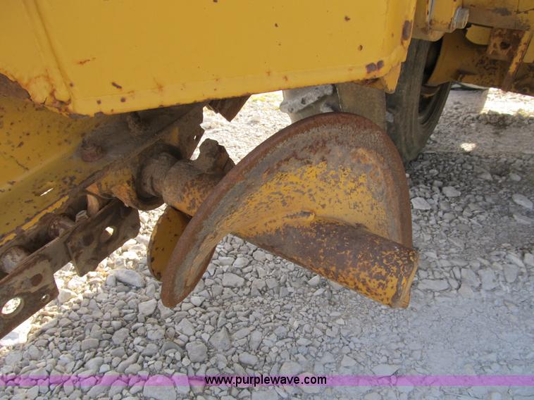image for item B2702 1999 Vermeer V4750 trencher/backhoe combo with cable plow