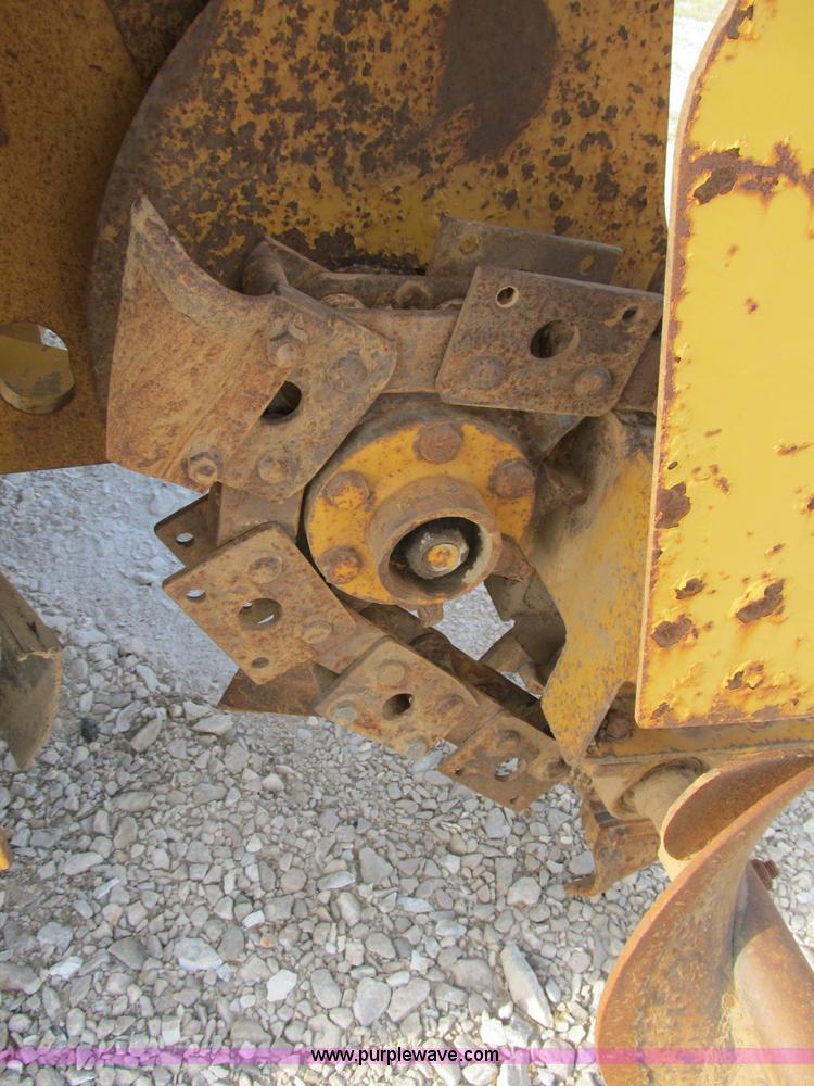 image for item B2702 1999 Vermeer V4750 trencher/backhoe combo with cable plow