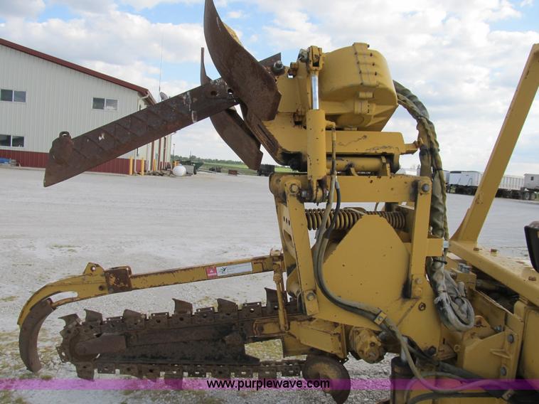 image for item B2702 1999 Vermeer V4750 trencher/backhoe combo with cable plow