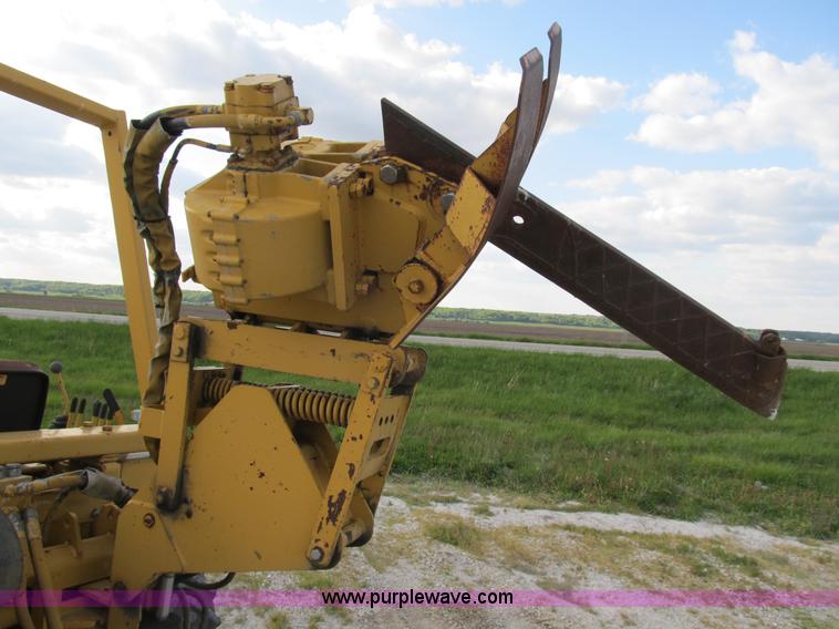 image for item B2702 1999 Vermeer V4750 trencher/backhoe combo with cable plow