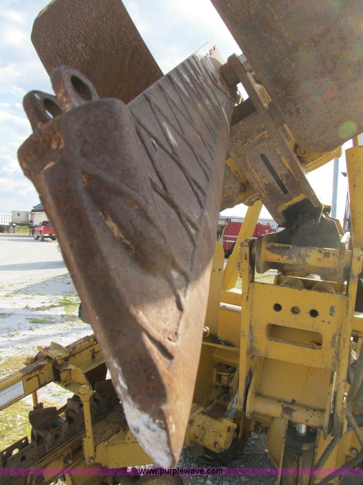 image for item B2702 1999 Vermeer V4750 trencher/backhoe combo with cable plow